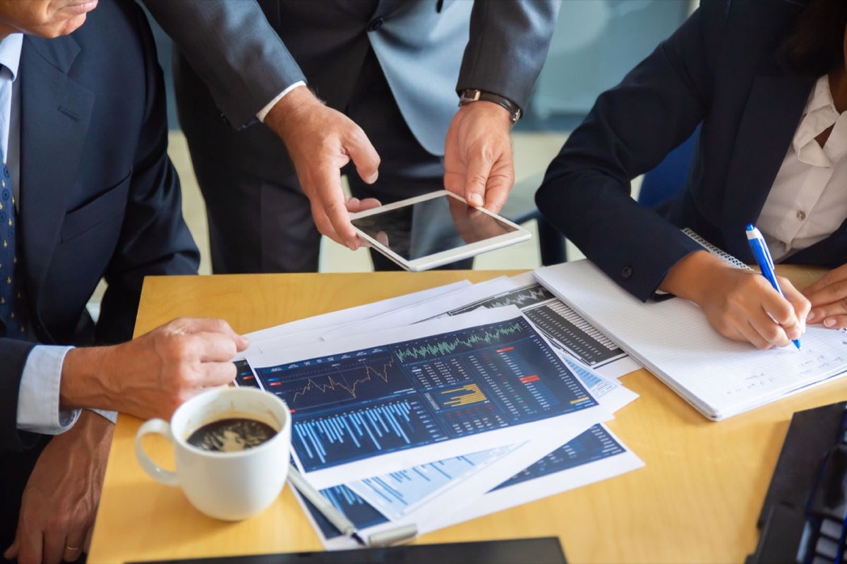 Business partners reviewing financial reports
