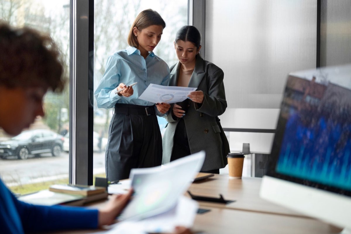 Team analysing finance data in an office